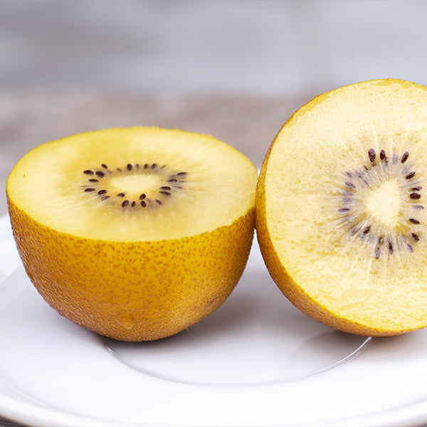 Golden Jintao-Kiwifruits in a 2.7 kg carton, fresh and ripe, from Sharbatly, showing vibrant yellow skin and fuzzy texture.