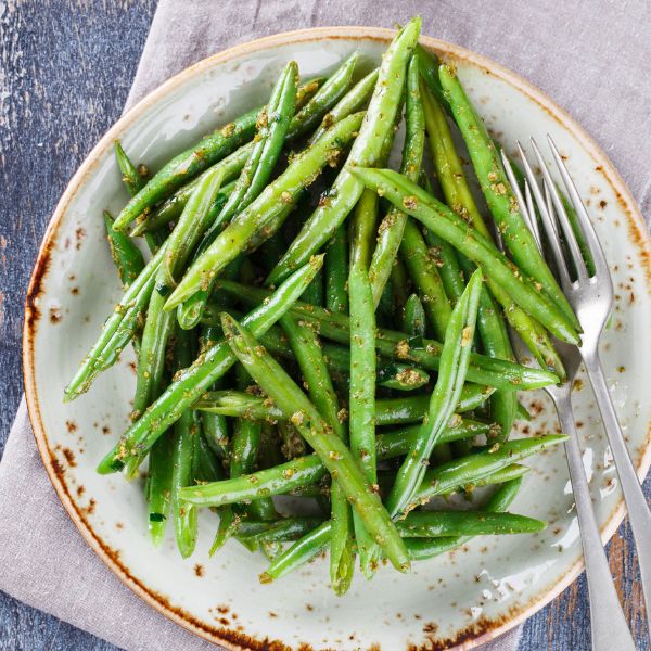 Fresh bobby beans in a 0.5 kg pack from Local Market, showing vibrant green vegetable beans on a clean surface.