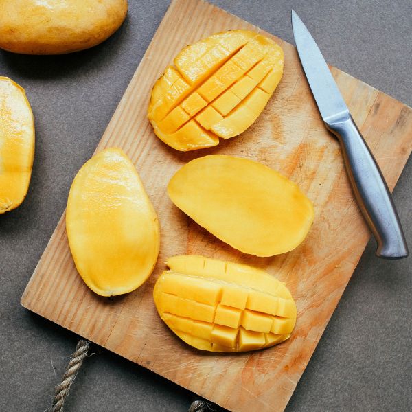 Fresh Chaunsa mangoes from Local Market in a 2.5kg carton, showcasing ripe, vibrant yellow and orange fruit ready to eat.
