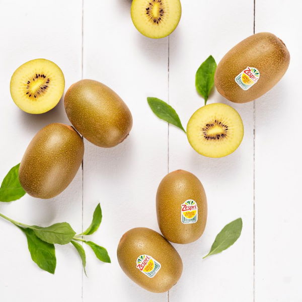 Six yellow Kiwifruits Sungold by Zespri, fresh and ripe, displayed on a white background.